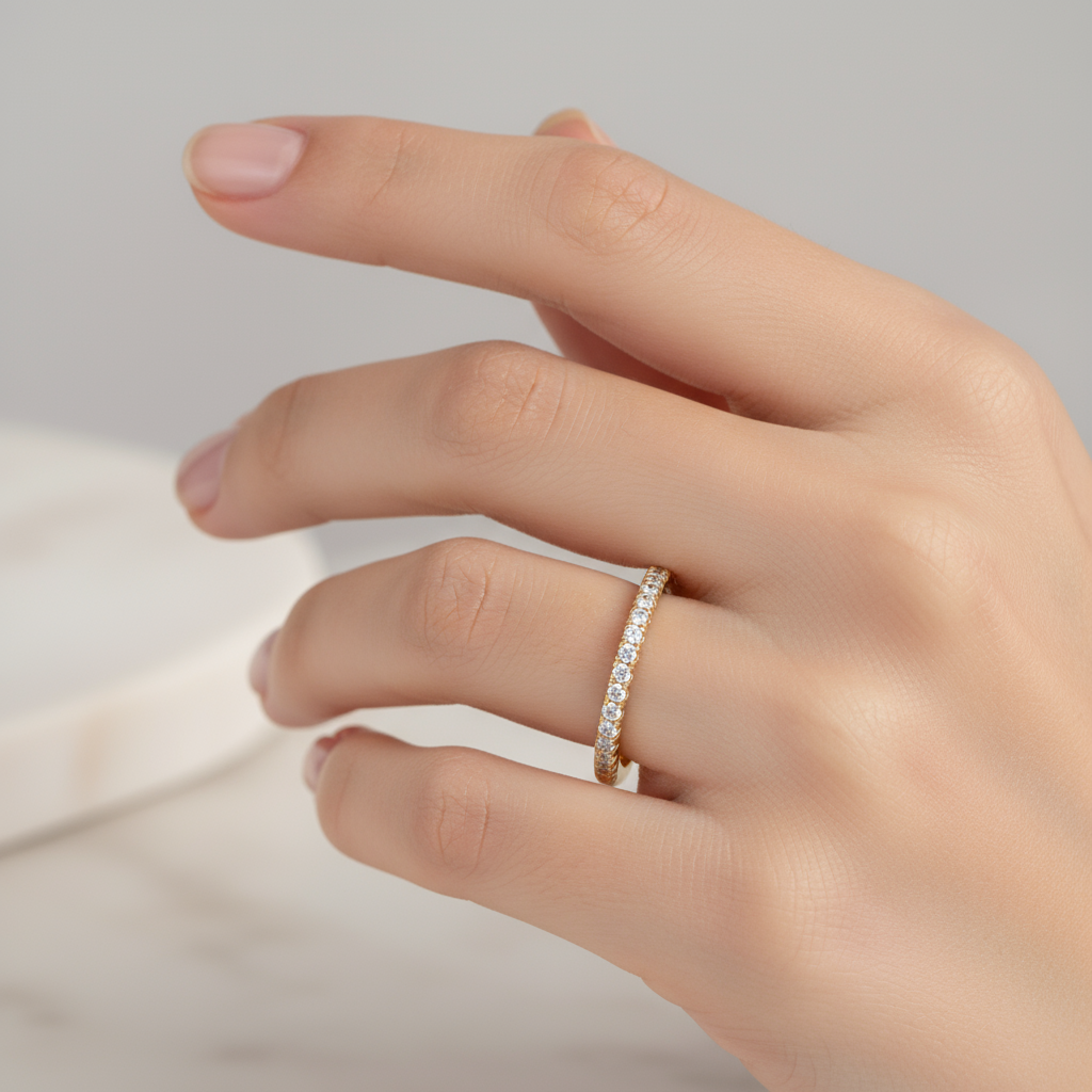 Female model wearing diamond half-eternity band ring