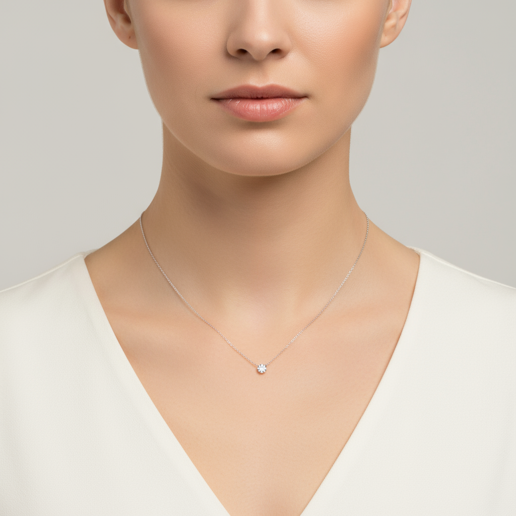 Female model wearing diamond solitaire necklace