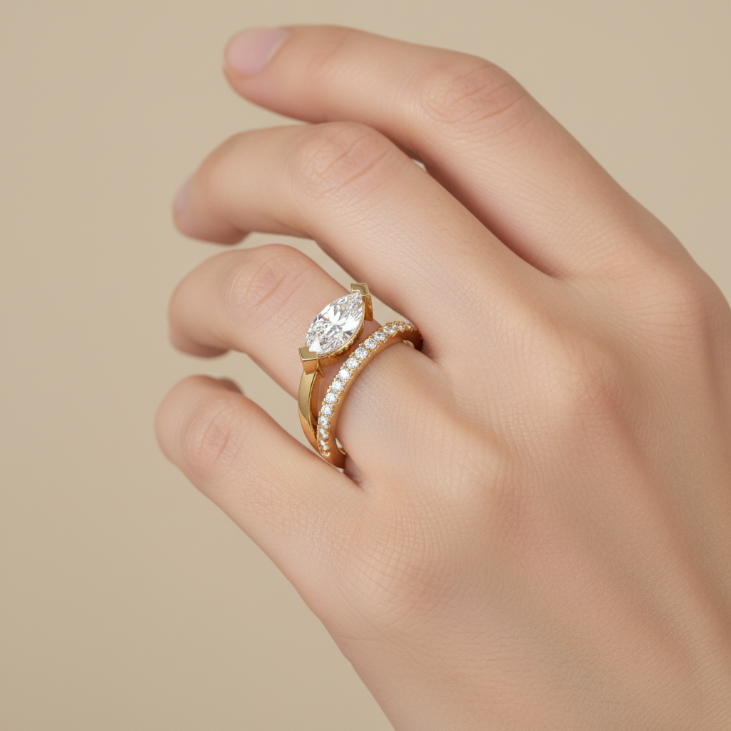 Female model wearing marquise-cut diamond bypass engagement ring