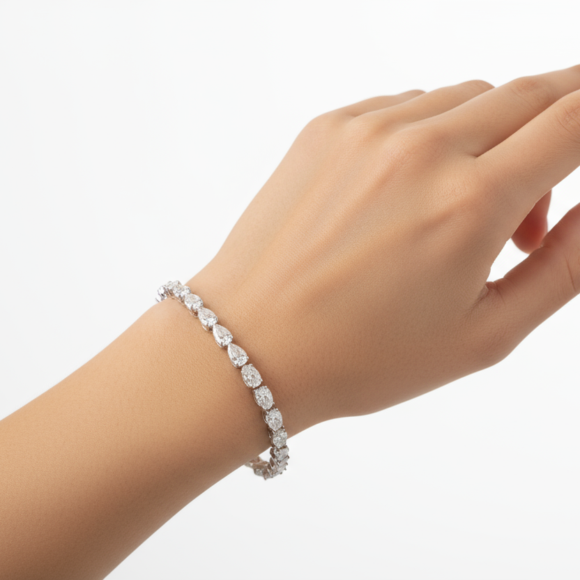Female model wearing pear diamond bracelet
