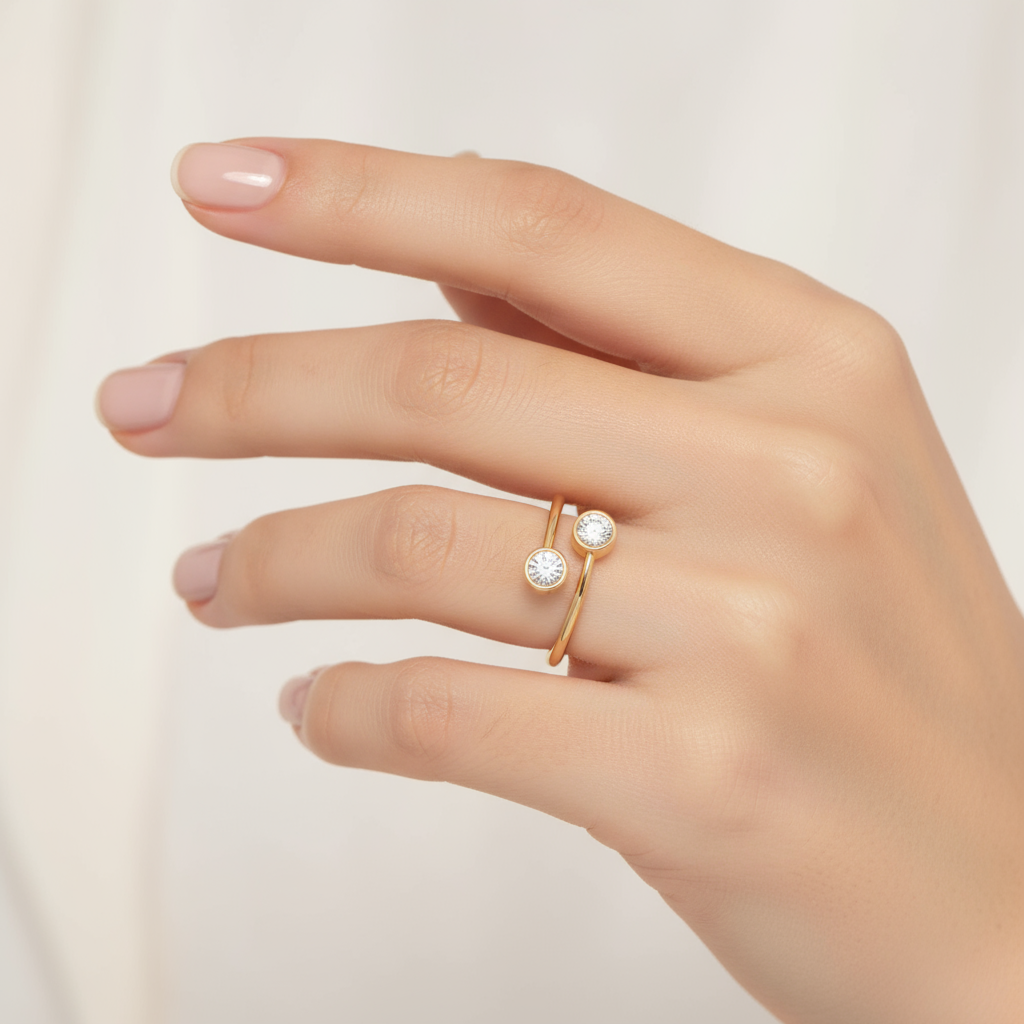Female model wearing two-stone bezel-set diamond ring