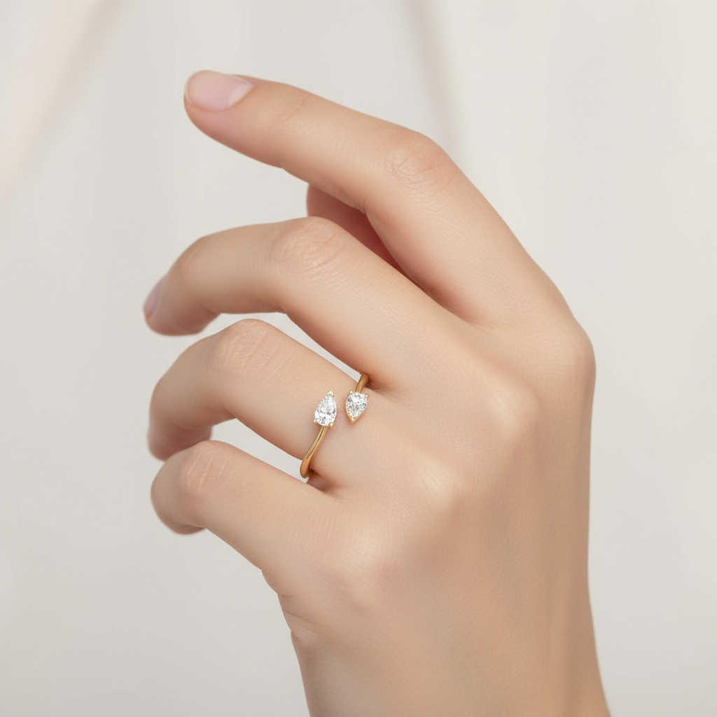 Female model wearing two-stone pear-shaped diamond ring