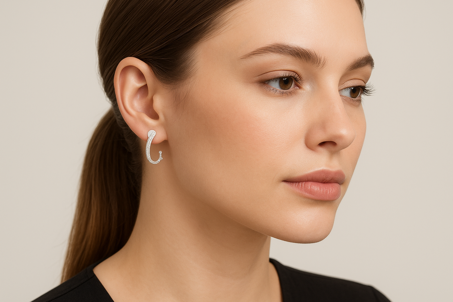 Generated image of a female model wearing the white gold and diamond hoop earrings in a smaller size