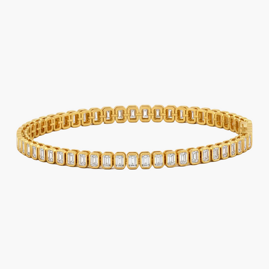 Gold bracelet with diamond accents on a white background