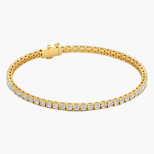 Gold bracelet with diamond accents on a white background