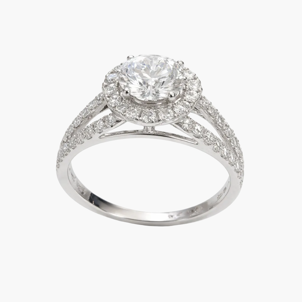 Diamond ring with a halo and intricate design on a white background
