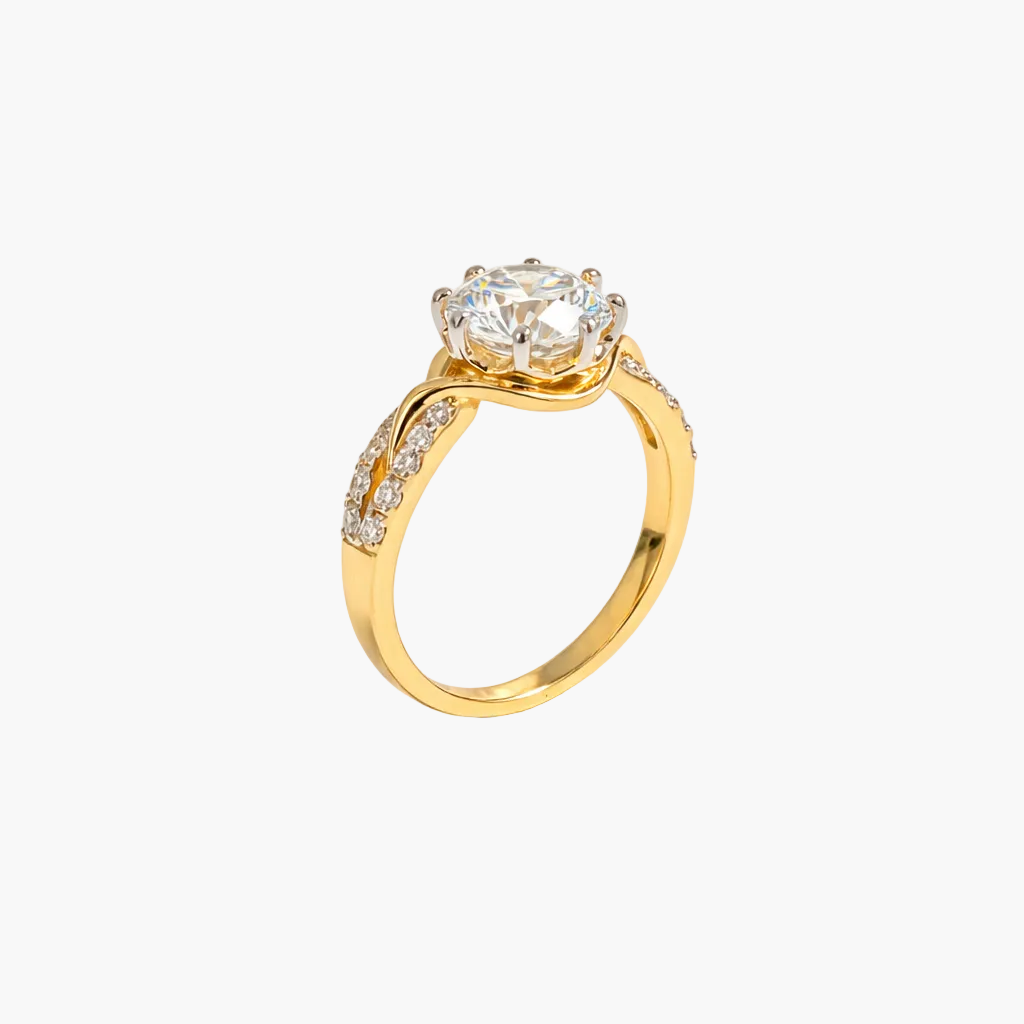 Gold ring with a large diamond and smaller diamonds on the band against a white background
