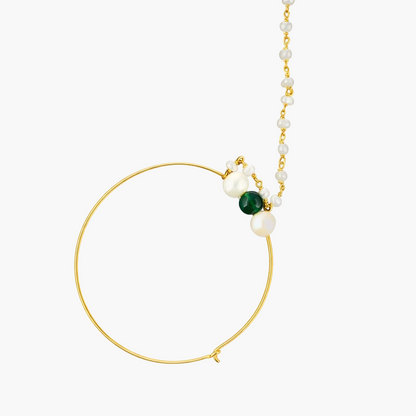 Gold hoop earring with pearls and a green gemstone on a white background