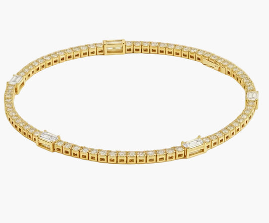 Gold bracelet with clear stones on a white background