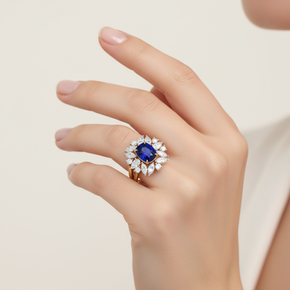 Female model wearing blue sapphire and diamond ring