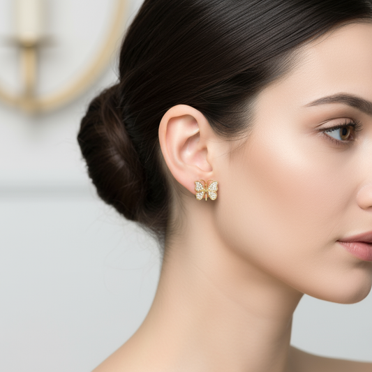 Female model wearing butterfly diamond earrings