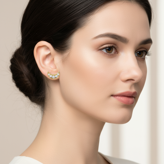 Female model wearing crescent moon diamond stud earrings