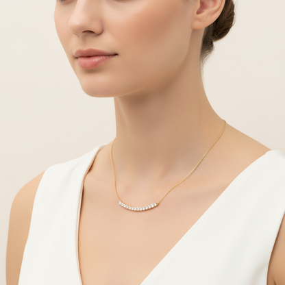 Female model wearing curved diamond bar necklace
