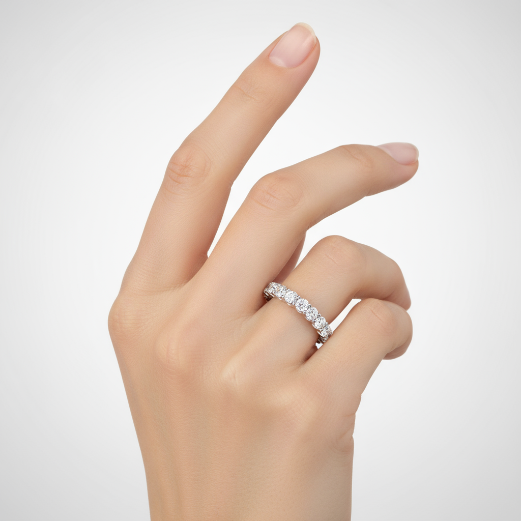 Female model wearing diamond eternity band ring