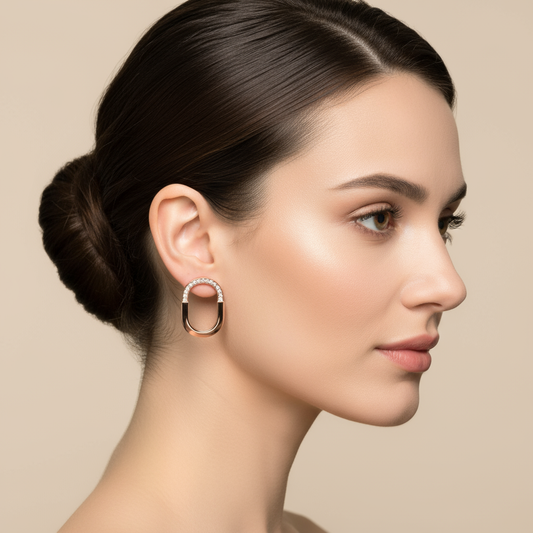 Female model wearing diamond oval hoop earrings