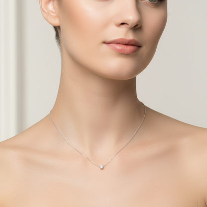 Female model wearing diamond solitaire necklace