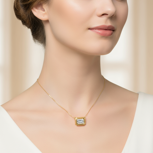 Female model wearing emerald-cut diamond bezel pendant
