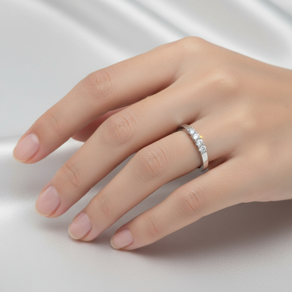 Female model wearing five-stone diamond ring