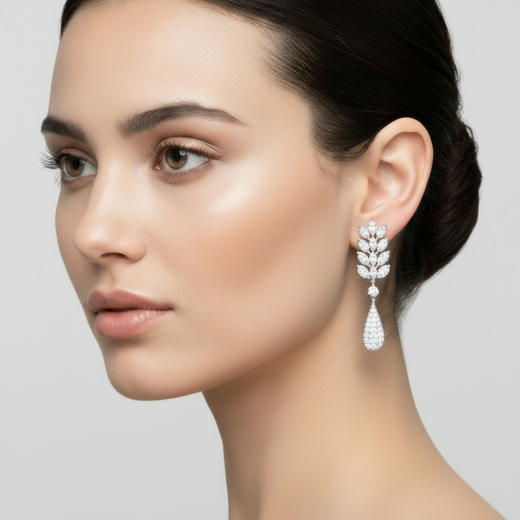 Female model wearing marquise diamond leaf chandelier earrings with pavé teardrop drops