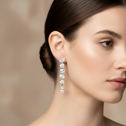 Female model wearing mixed-shape diamond drop earrings