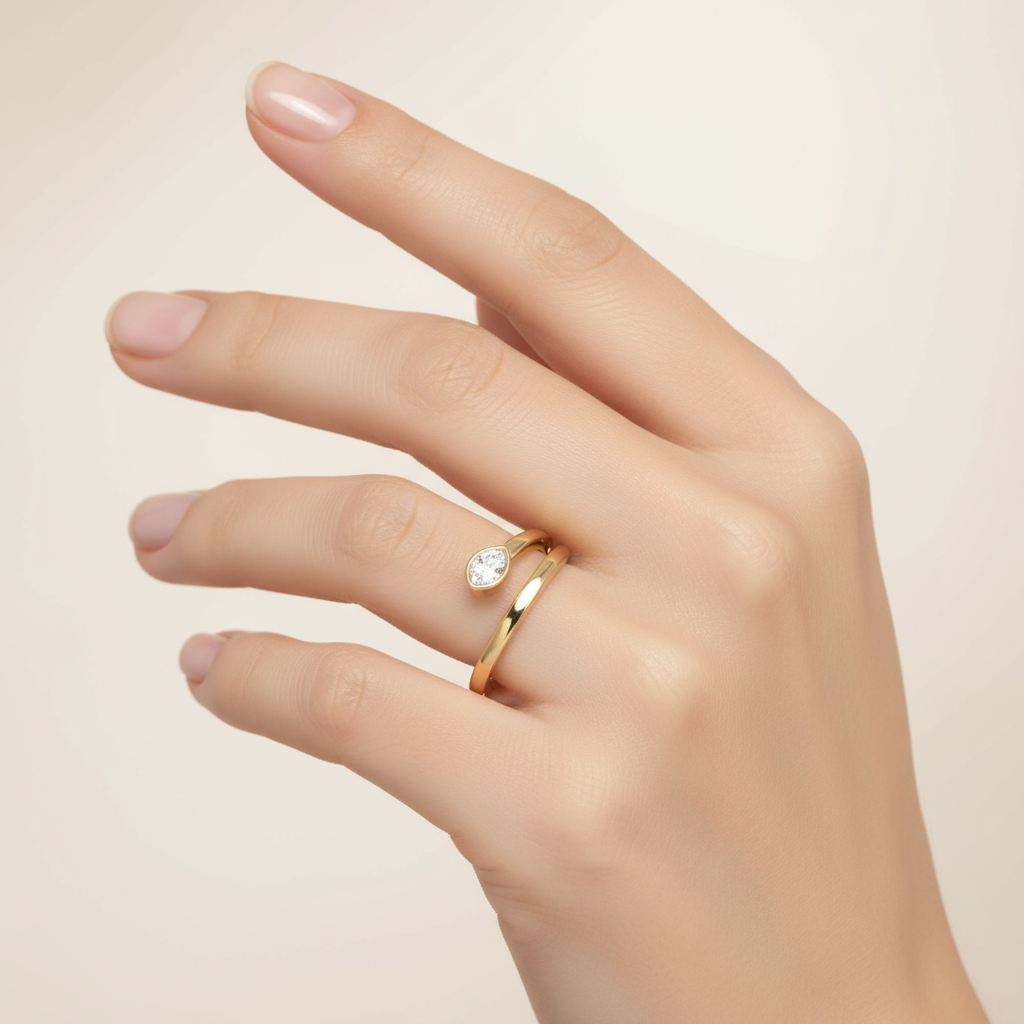 Female model wearing modern bezel-set diamond ring