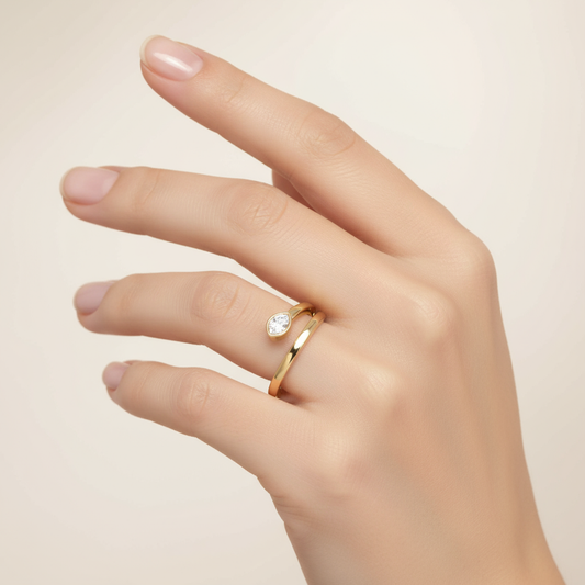 Female model wearing modern bezel-set diamond ring