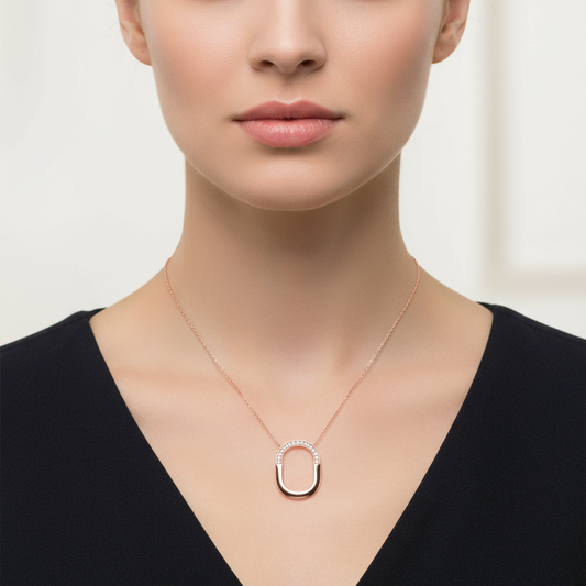 Female model wearing modern diamond pendant