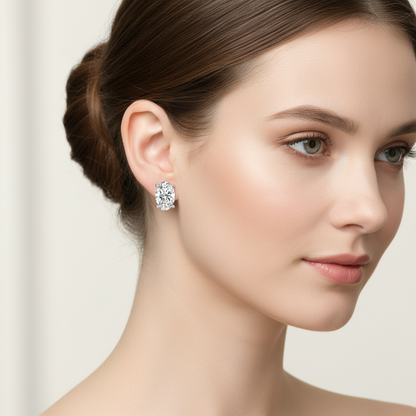 Female model wearing oval diamond solitaire stud earrings