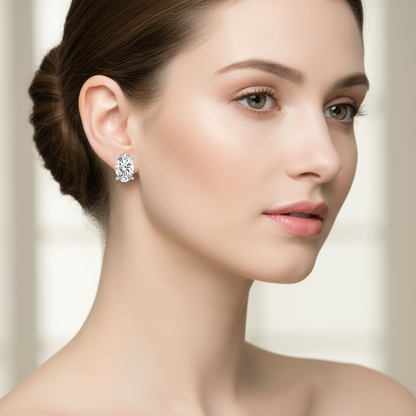 Female model wearing oval diamond stud earrings