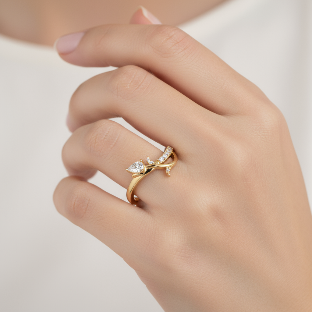 Female model wearing pear-shaped diamond ring