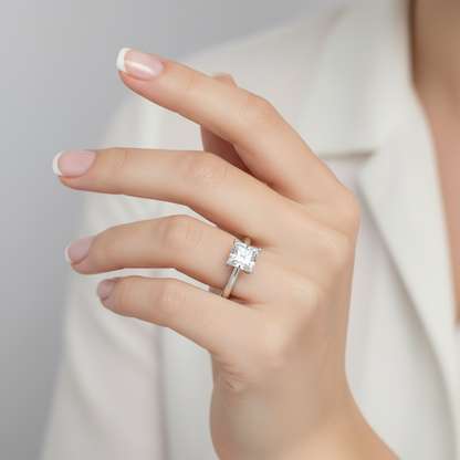 Female model wearing princess-cut diamond solitaire ring