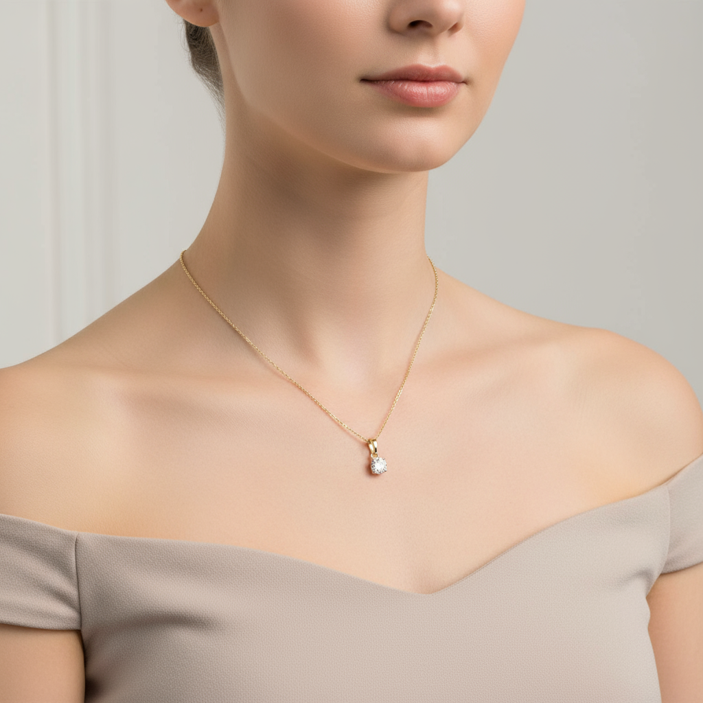 Female model wearing round diamond solitaire pendant necklace