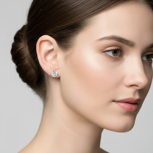 Female model wearing round diamond solitaire stud earrings