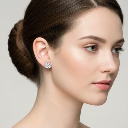 Female model wearing round diamond solitaire stud earrings