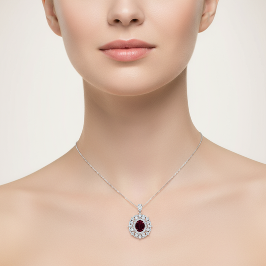 Female model wearing ruby and diamond pendant