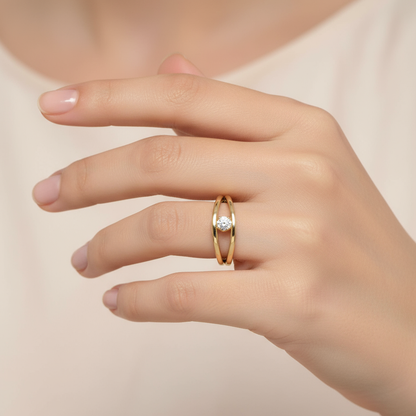 Female model wearing split-shank diamond solitaire ring