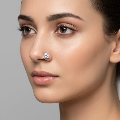 Female model wearing three-stone diamond nose pin