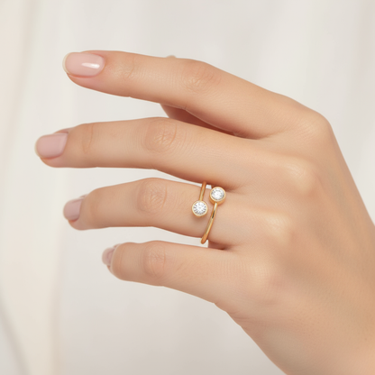 Female model wearing two-stone bezel-set diamond ring