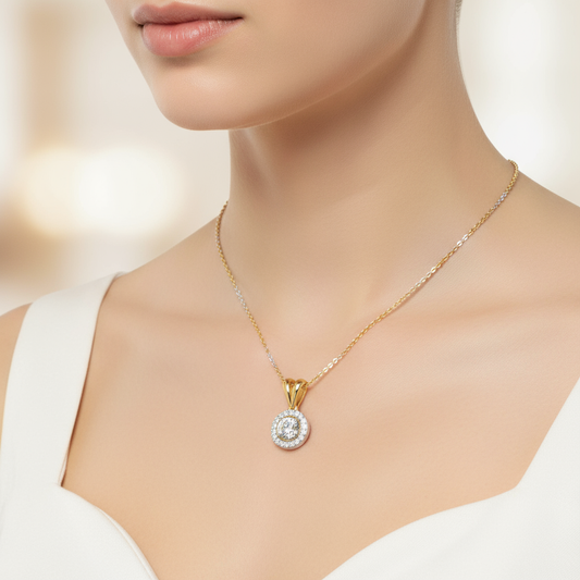 Female model wearing two-tone diamond halo pendant