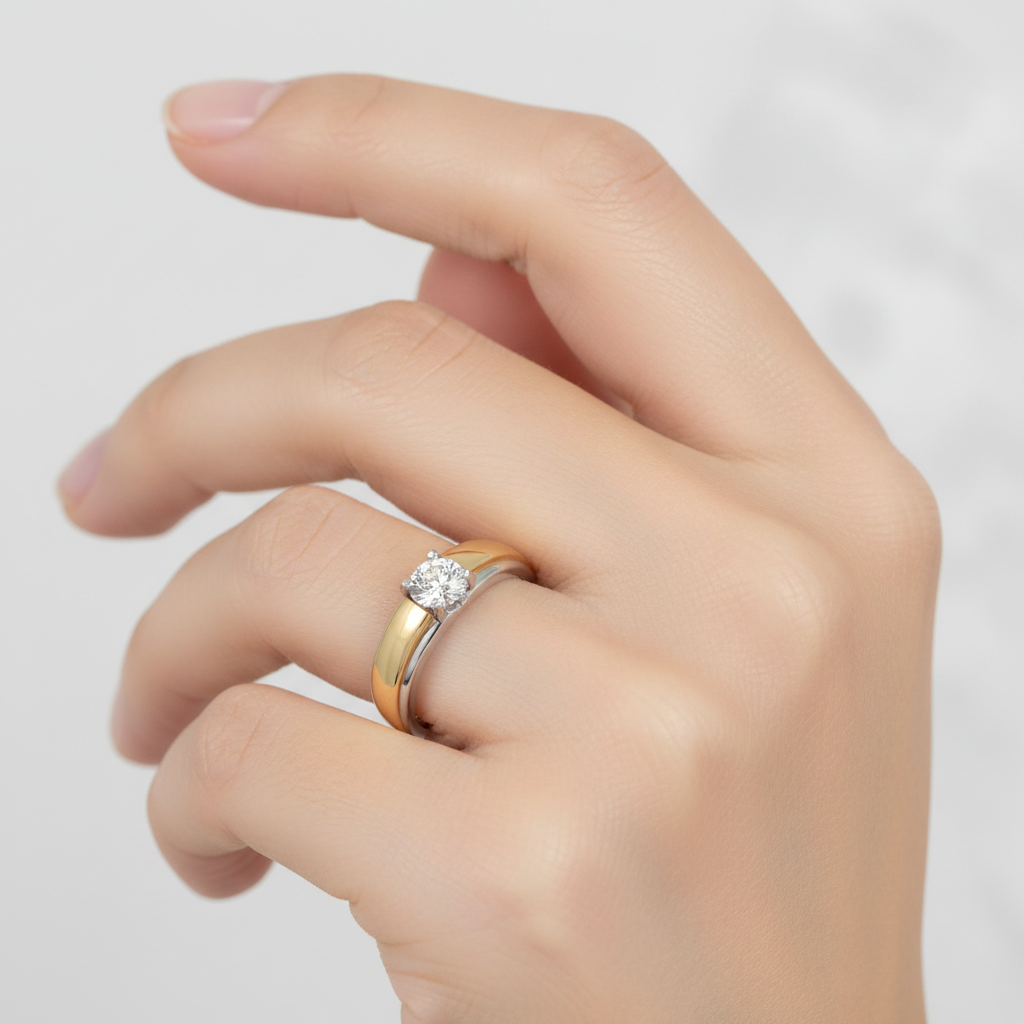 Female model wearing two-tone solitaire diamond ring