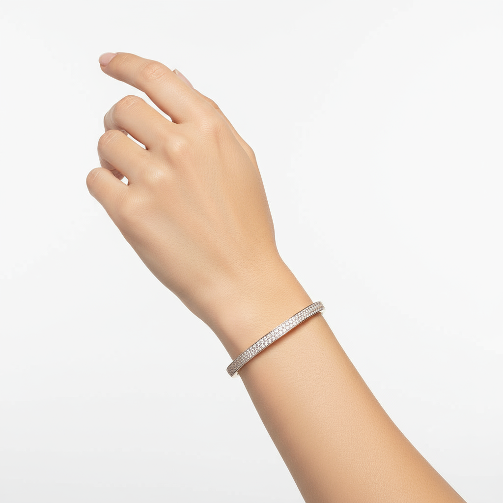 Generated image of a female model wearing small-sized rose gold bangle bracelet with pavé diamonds