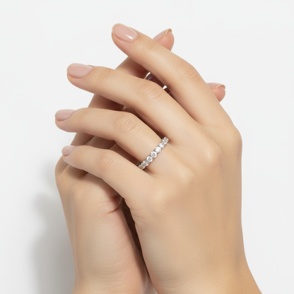 Generated image of a female model wearing small-sized white gold and diamond eternity band