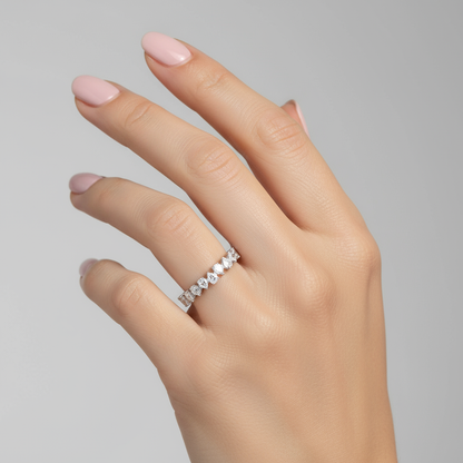 Generated image of a female model wearing small-sized white gold and marquise diamond eternity band