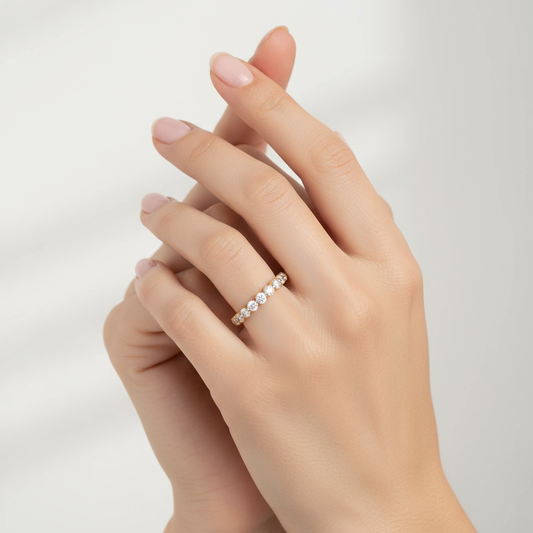 Generated image of a female model wearing small-sized yellow gold and diamond eternity band ring