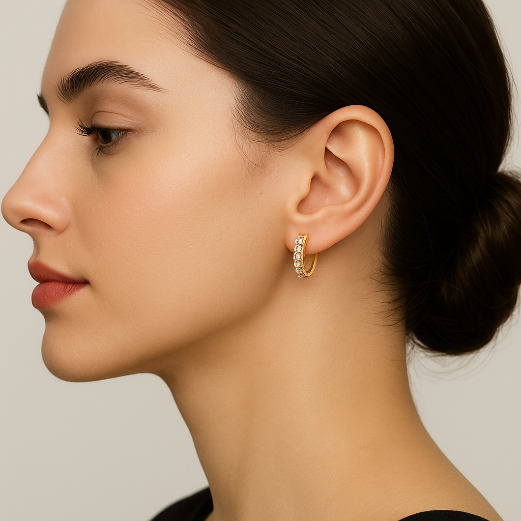 Generated image of a female model wearing the diamond huggie hoop earrings in small size