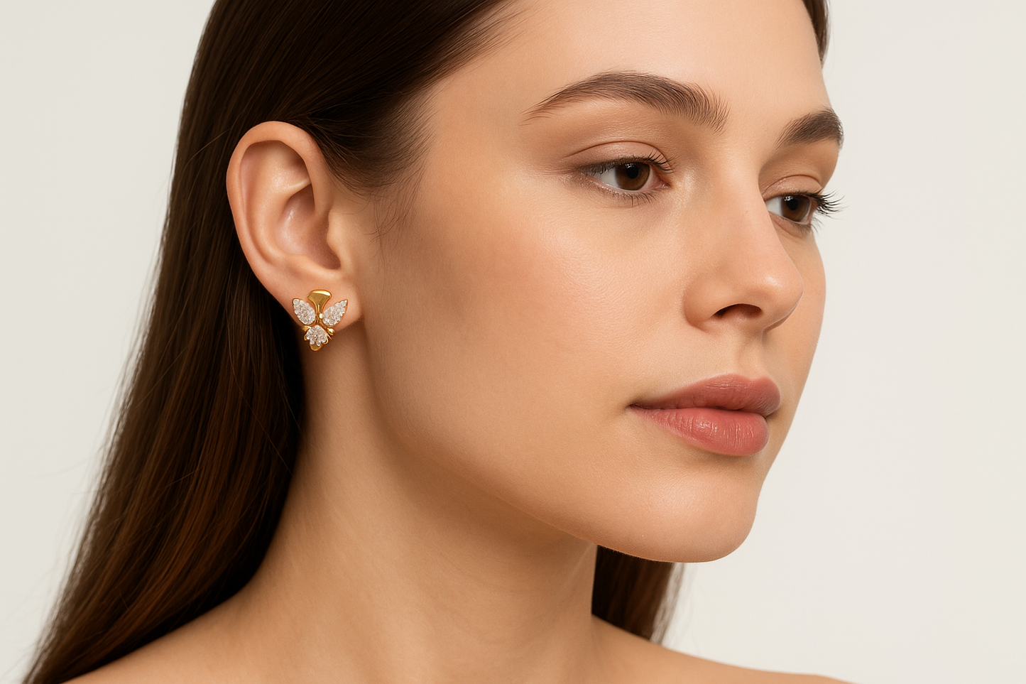 Generated image of a female model wearing the gold and diamond butterfly earrings