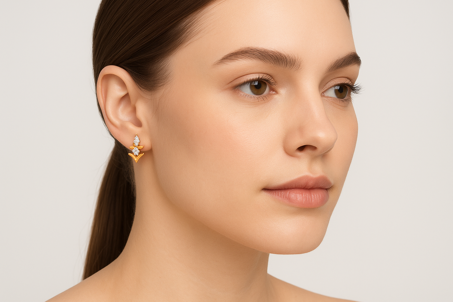 Generated image of a female model wearing the gold and diamond geometric earrings in a smaller size
