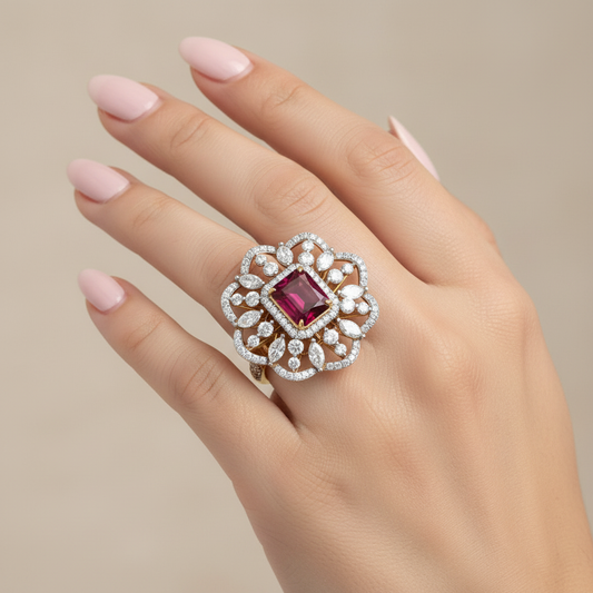 Yellow gold cushion-cut ruby and mixed-cut diamond floral cluster cocktail ring on model